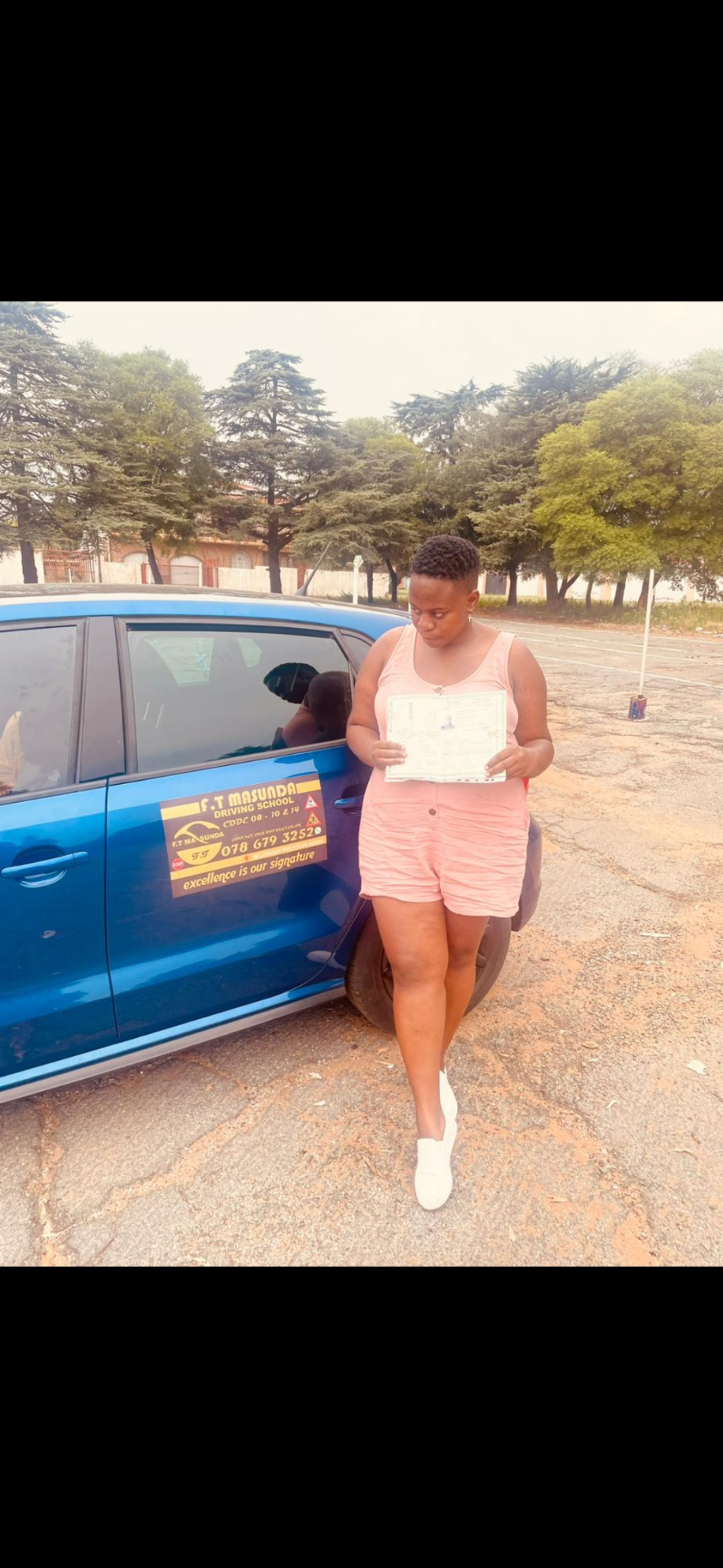 F.T Masunda student reviewing her test paperwork at the depot